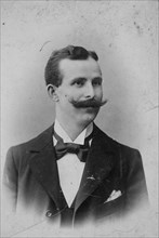 Man with moustache and suit