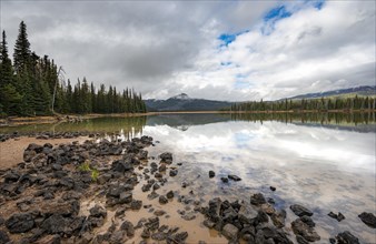 Black stones on the lake shore