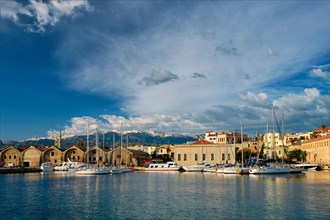 Yachts boats in picturesque old port of Chania is one of landmarks and tourist destinations of Crete island in the morning. Chania