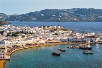 View of Mykonos town Greek tourist holiday vacation destination with famous windmills