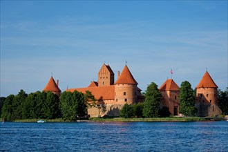 Trakai Island Castle in lake Galve with boats in summer day