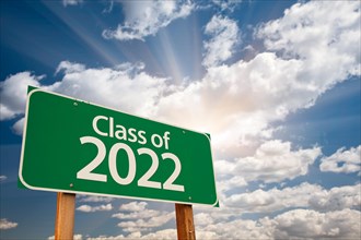 Class of 2022 green road sign with dramatic clouds and sky
