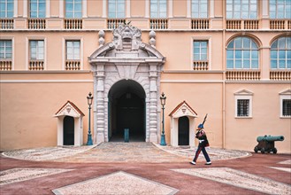 Motion blurred marching sentry guard in front of entrance of Prince's Palace of Monaco