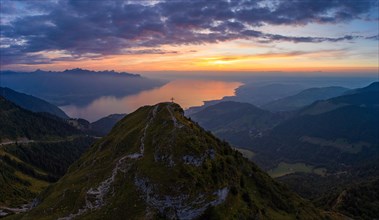Aerial view of Dent de Jaman with the summit cross and Lake Geneva in the background after sunset