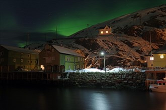 Small harbour with illuminated houses
