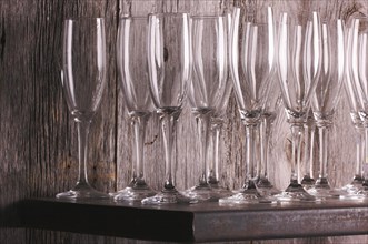Champagne flutes on shelf abstract