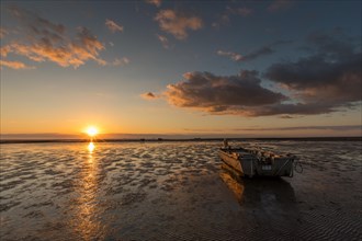Sunset over the mudflats at low tide at Holmersiel