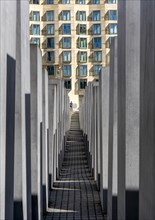 Narrow walkway between the stelae of the Holocaust Memorial