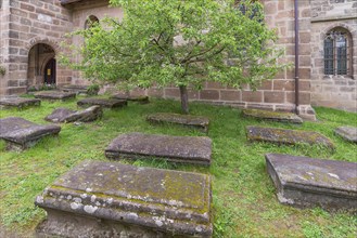 Old graves in the churchyard of the fortified church of St. George