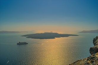 View over the Caldera with cruise ship at sunset