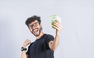 Excited man with money in hand