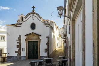 Charming chapel of Our Lady of Pity between narrow streets of Tavira