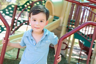 Chinese and caucasian boy having fun at the playground