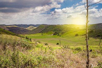 View of hills with clouds and blue sky