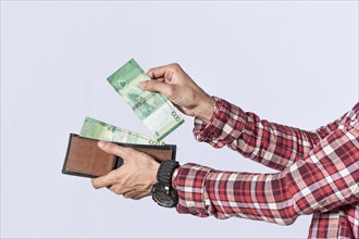 Man taking money out of his wallet