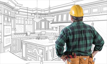 Male contractor with hard hat and tool belt looking at custom kitchen drawing on white