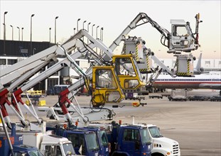 Deicing equipment ready at an airport during A blustery winter day