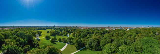 English Garden in Munich at springtime with green trees and the Monopterostempel as Aerial