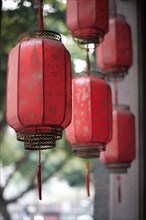 Arow of Chinese red lanterns with background blur