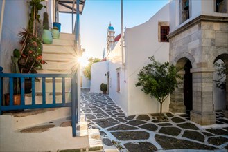Picturesque scenic narrow streets with traditional whitewashed houses with blue doors windows of Mykonos Chora town in famous tourist attraction Mykonos island