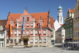 Market square with large guild and Kreuzherrnkirche church in the market square of Memmingen