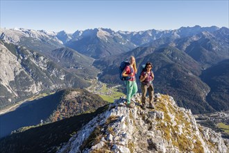 Two female hikers on a summit