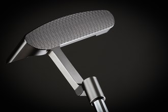 Face of golf club putter on A dark background