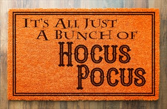 It's all A bunch of hocus pocus halloween orange welcome mat on wood floor background