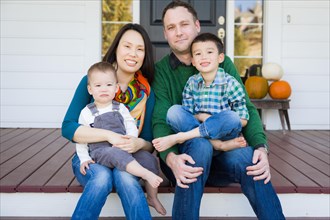 mixed-race chinese and caucasian young family portrait