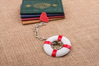 Little books attached to a life saver with a chain