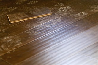 Newly installed dusty brown laminate flooring abstract