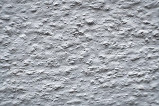 A white wall with bumps