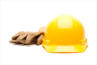 Yellow hard hat and gloves isolated on white
