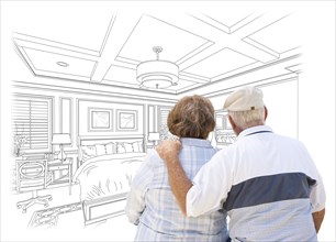 Curious senior couple looking over custom bedroom design drawing