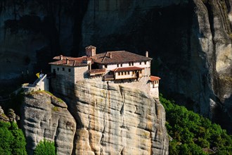 Monastery of Rousanou in famous greek tourist destination Meteora in Greece on sunset with scenic landscape