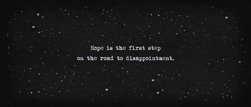 Hope is the first step on the road to disappointment. Famous quote as text art illustration. Typewriter font style over vintage paper dark background