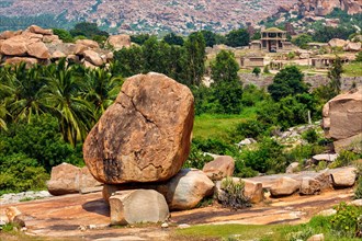 Giant boulder and ancient ruins in Hampi. Way to Vittala Temple. Sule Bazaar
