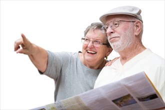 Happy senior adult couple with brochure pointing isolated on a white background