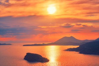 Aegean Sea with Greek islands view on sunset. Cape Sounion