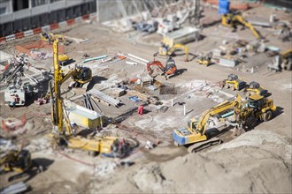 Aerial view of busy construction site with extreme bokeh
