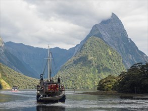 Excursion boat in front of Mitre Peak