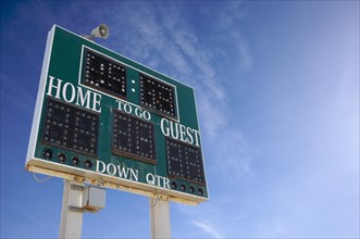 HIgh school score board on a blue sky