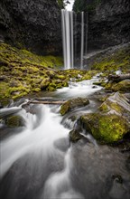 Waterfall cascading over rocky outcrop