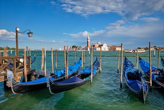 Gondolas and in lagoon of Venice by Saint Mark