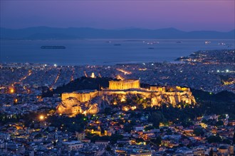Parthenon Temple on hill is the antique tourist landmark at the Acropolis of Athens and ancient European civilization architecture on Aegean sea coast. Dusk view from Mount Lycabettus