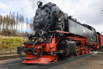 Close-up of steam locomotive with snowplough of Brockenbahn in Schierke station