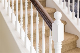 Abstract of beautiful stair railing and carpeted steps in house
