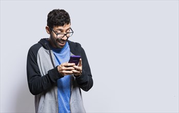Person smiling and using cell phone isolated