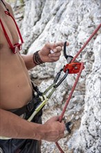 Climber belays with a Grigori belay device