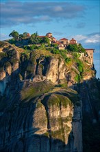 Great Meteoron Monastery perched on a cliff in famous greek tourist destination Meteora in Greece on sunrise